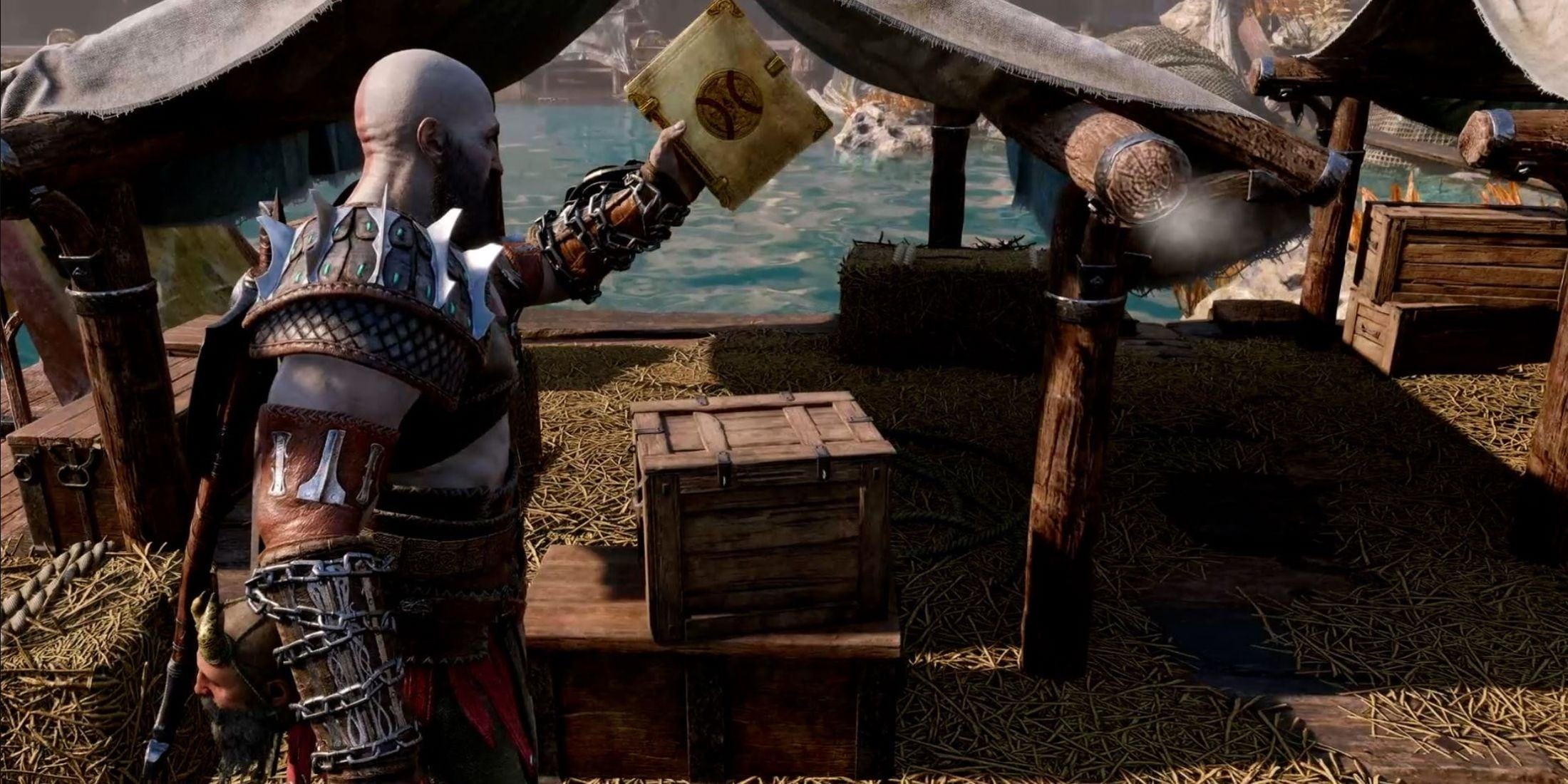 God of War's Kratos holding a book of Kvasir's poems in his left hand.