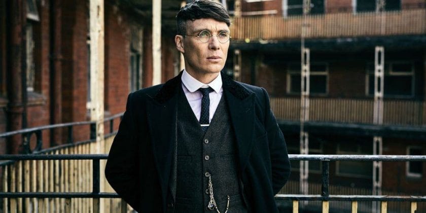 Thomas Shelby (Cillian Murphy) wears a vest and glasses in Peaky Blinders