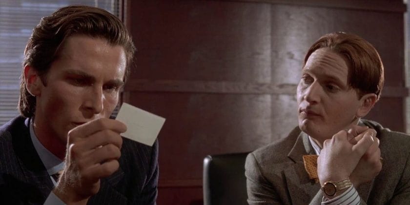 Patrick Bateman looking at Paul Allen's business card in American Psycho.
