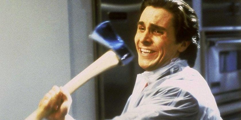 Christian Bale as Patrick Bateman in American Psycho swinging an axe wildly around his apartment in a sheer rain slicker with a depraved smile on his face