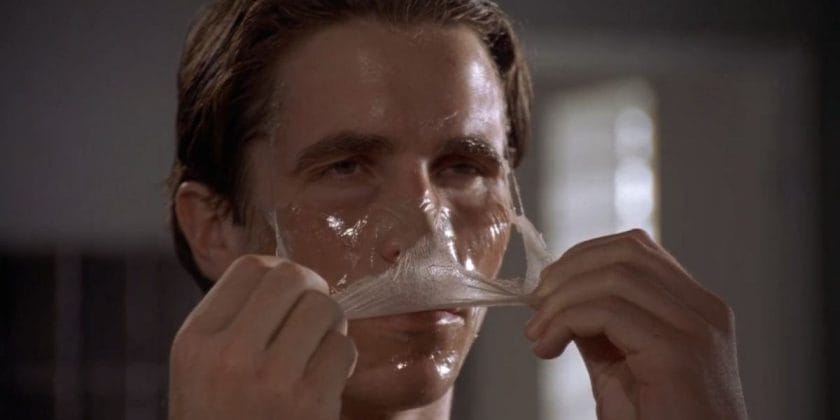 Christian Bale as Patrick Bateman from American Psycho doing a chemical peel on his skin