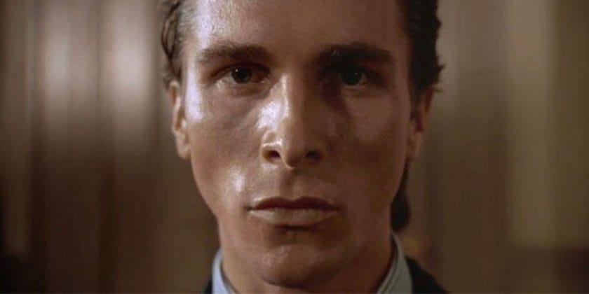 Patrick Bateman staring blankly into the camera with freshly moisturized skin and perfect cheekbones