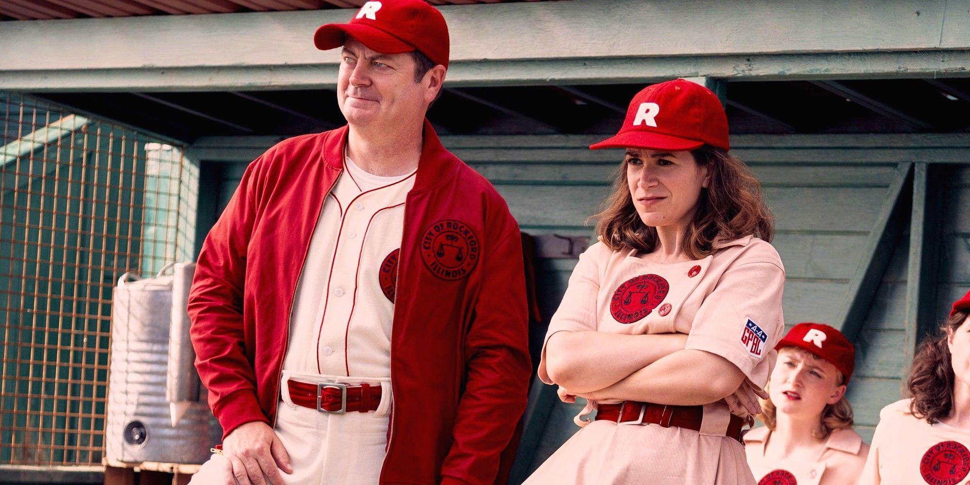 Nick Offerman and Abbi Jacobson dressing in baseball uniforms standing in a dugout on A League of Their Own