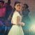 Maria looks behind her at the dance in West Side Story