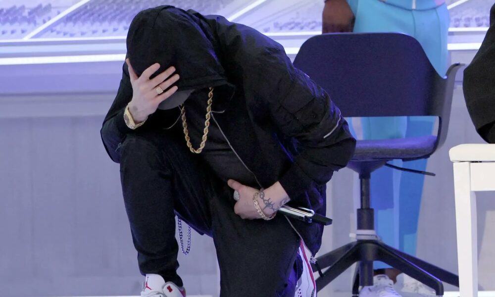 Why Eminem Took A Knee During Super Bowl 2022 Halftime Performance
