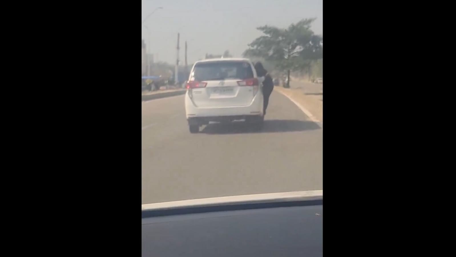 UP woman hanging from the door of a moving car prompts Lucknow Police to take action