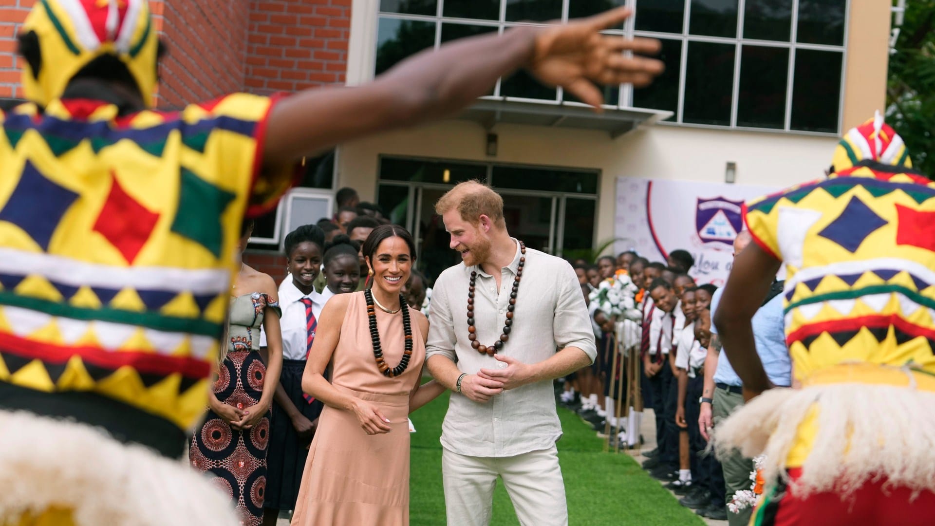 Meghan & Harry dance with schoolkids before duchess heaps praise on her 'smart' husband who 'always tells the truth'