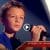 A ten-year-old child captivates the audience of "The Voice" with a sincere performance of the song "Knockin' on Heaven's Door" by Bob Dylan from 1973.