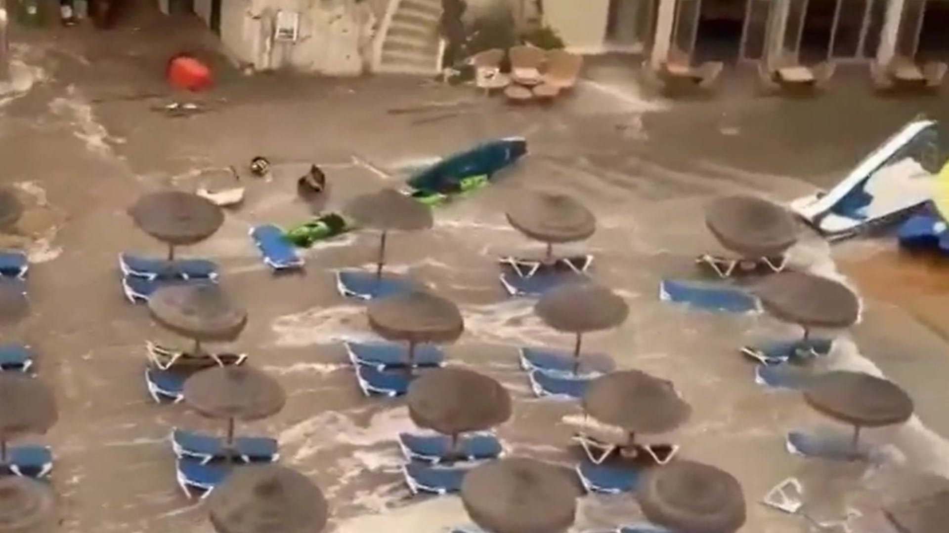Watch moment huge 'meteo-tsunami' sends tourists scrambling & washes away sunbeds in hols hotspot Menorca